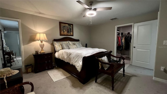 10854 Sage Canyon Dr, Riverview, FL 33578 - bedroom with a closet, light colored carpet, visible vents, a spacious closet, and ceiling fan