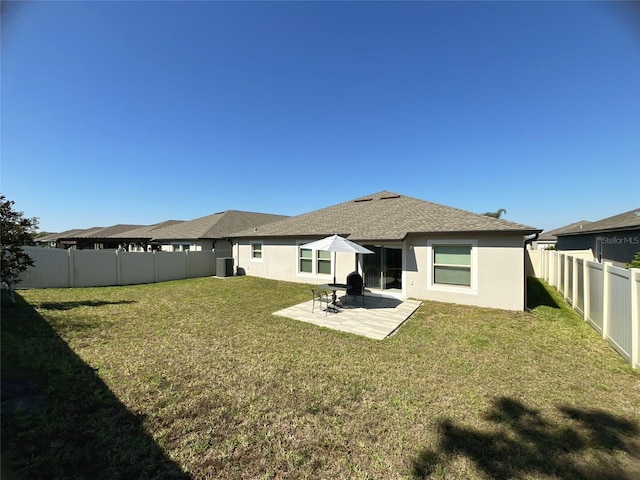 10854 Sage Canyon Dr, Riverview, FL 33578 - rear view of property with stucco siding, a fenced backyard, a yard, and a patio