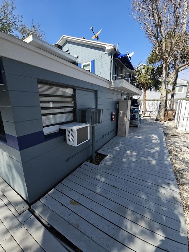 wooden terrace featuring cooling unit