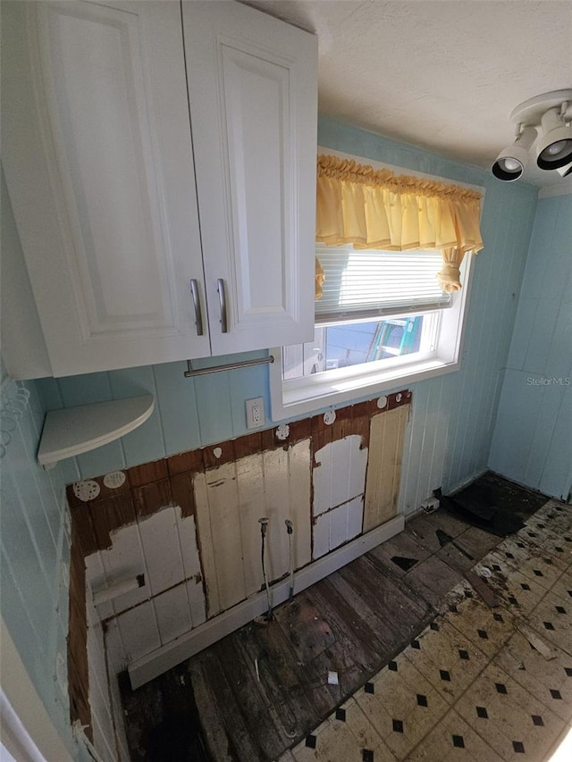 kitchen featuring white cabinets