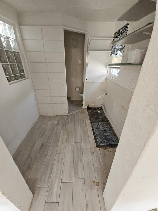 bathroom featuring hardwood / wood-style floors and toilet