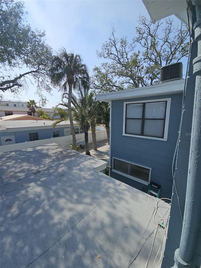 view of side of home with a patio and central AC unit