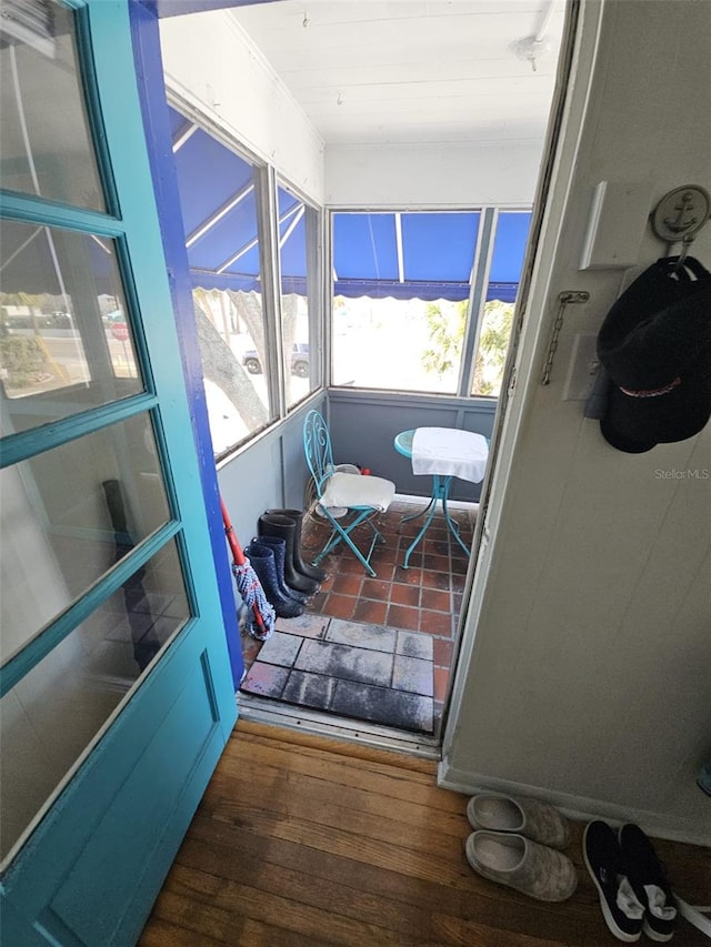 doorway to outside with dark hardwood / wood-style floors