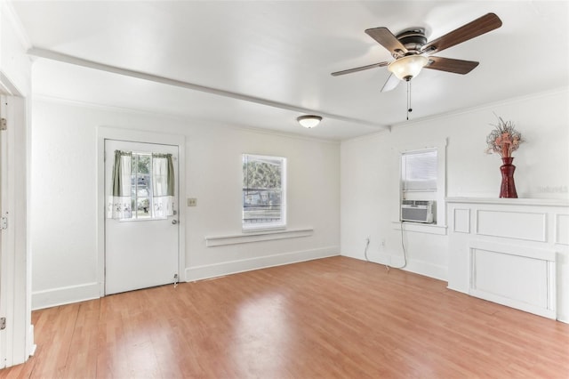 foyer with ornamental molding, ceiling fan, and light hardwood / wood-style flooring