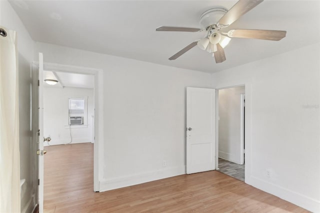 unfurnished room with ceiling fan and light hardwood / wood-style flooring