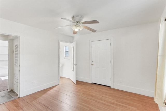 unfurnished bedroom with ensuite bath, light hardwood / wood-style flooring, and ceiling fan