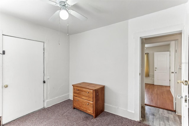 unfurnished bedroom featuring ceiling fan