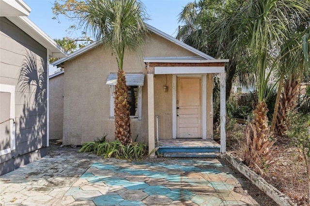 property entrance with a patio area