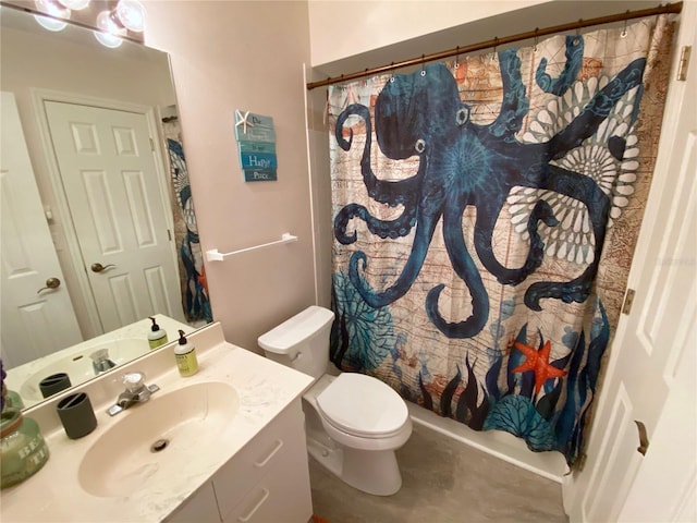 bathroom featuring vanity, toilet, and walk in shower