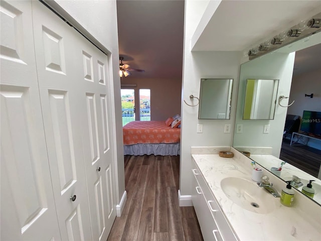 bathroom featuring vanity, wood-type flooring, and ceiling fan