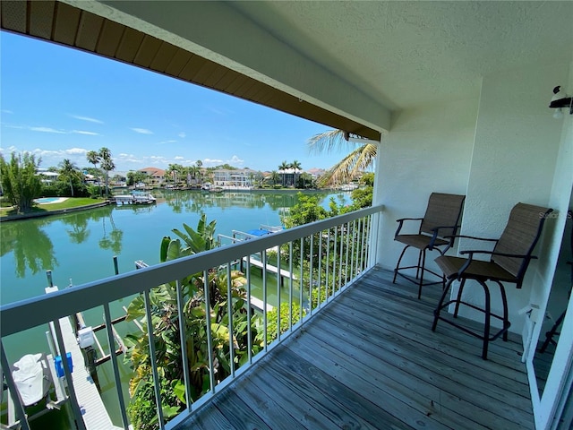 balcony featuring a water view