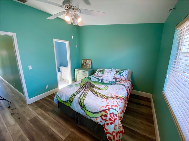 bedroom with ceiling fan, connected bathroom, and hardwood / wood-style floors