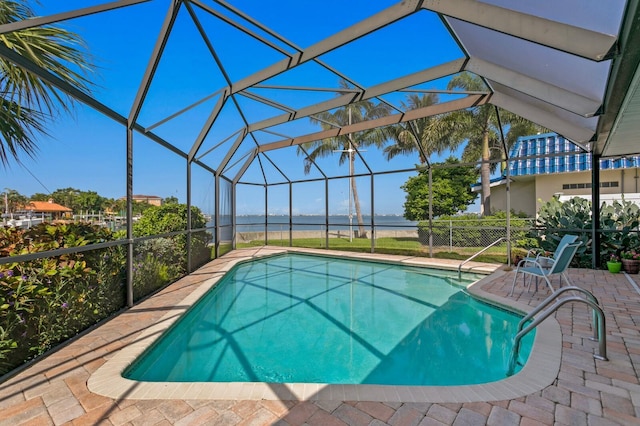 view of swimming pool with a patio area and glass enclosure