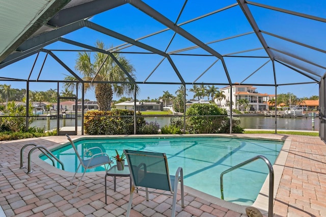 view of swimming pool featuring a water view, a lanai, and a patio