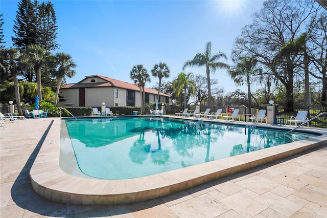 view of swimming pool with a patio area