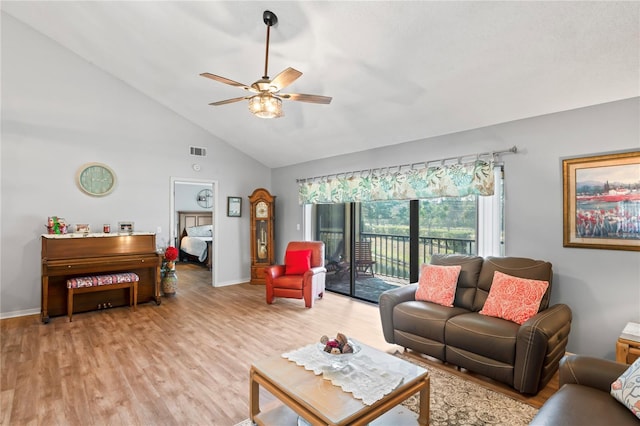 living room featuring ceiling fan, high vaulted ceiling, and light hardwood / wood-style flooring