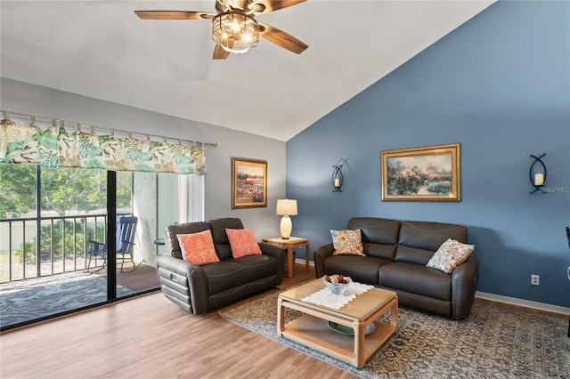 living room with vaulted ceiling, hardwood / wood-style floors, and ceiling fan