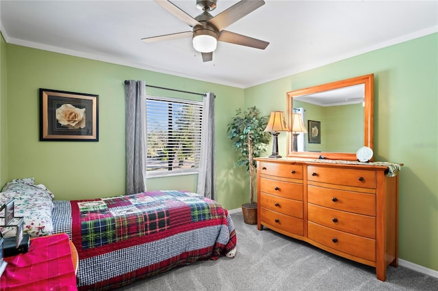 bedroom with light carpet, ornamental molding, and ceiling fan