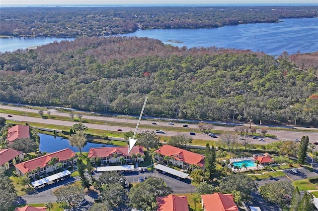 birds eye view of property featuring a water view