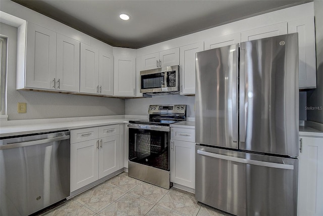 kitchen featuring white cabinetry and appliances with stainless steel finishes