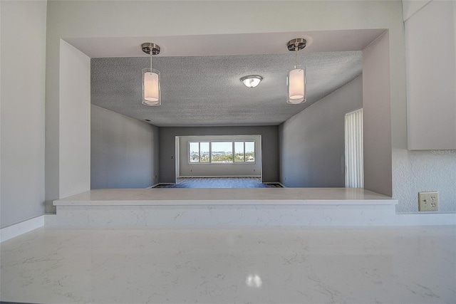 empty room with a textured ceiling