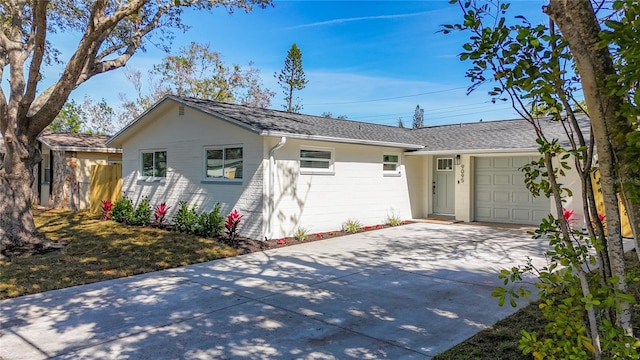 ranch-style home with a garage