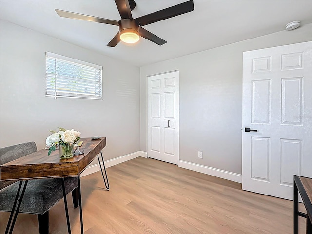 office featuring ceiling fan and light hardwood / wood-style flooring