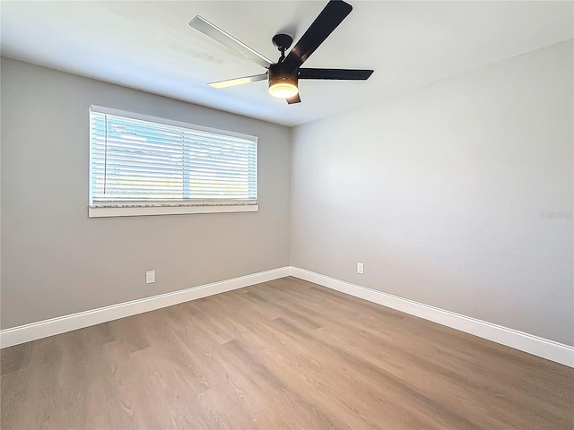 spare room with ceiling fan and light hardwood / wood-style flooring