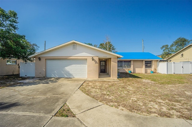 single story home featuring a garage