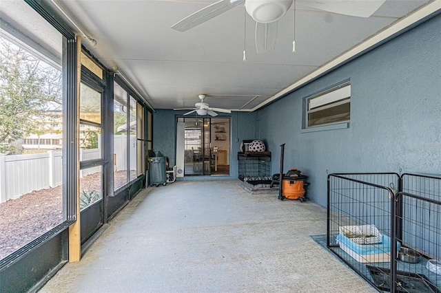 sunroom / solarium with ceiling fan