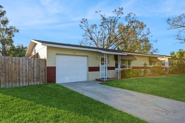 single story home with a garage and a front yard