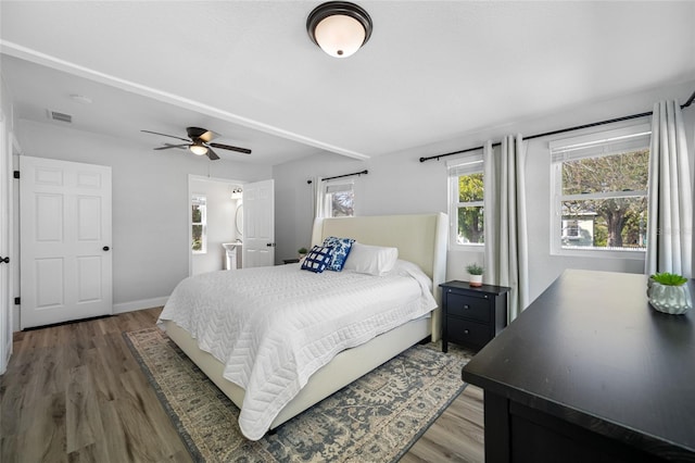 bedroom featuring dark wood-type flooring and ceiling fan