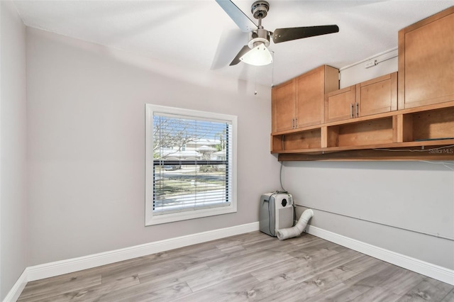 interior space with ceiling fan and light wood-type flooring