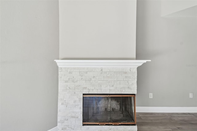 room details featuring a fireplace and hardwood / wood-style floors