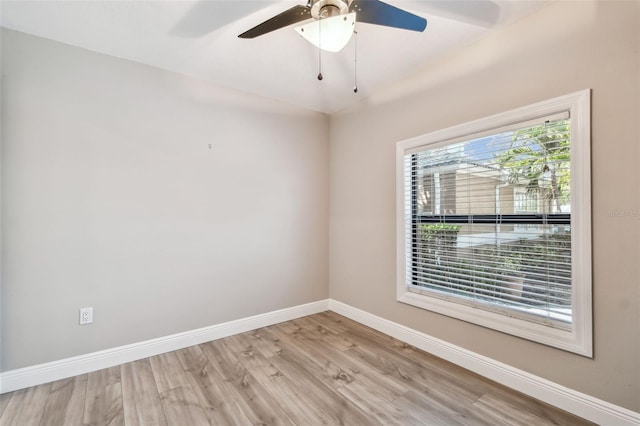 spare room featuring light hardwood / wood-style flooring and ceiling fan