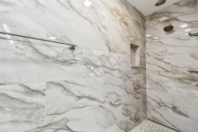 bathroom featuring tiled shower