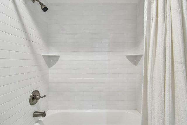 bathroom featuring shower / bathtub combination with curtain