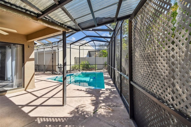 view of pool with a lanai and a patio