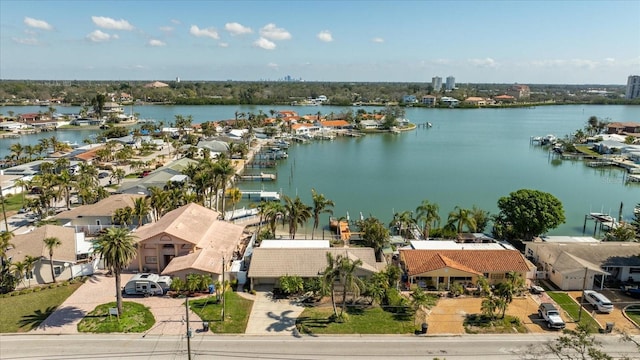 birds eye view of property with a water view