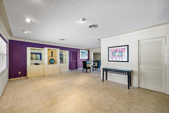 interior space with a textured ceiling