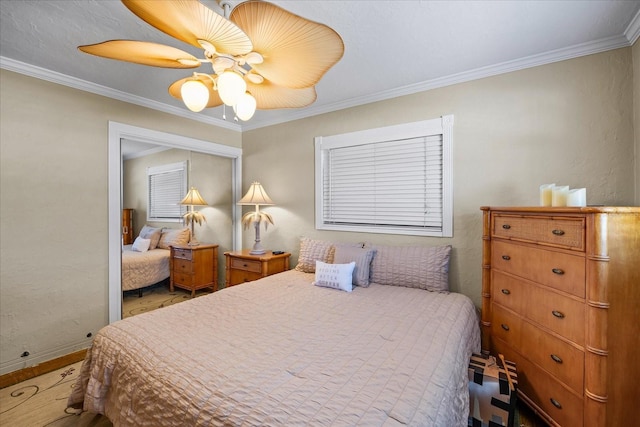 bedroom featuring ornamental molding and ceiling fan