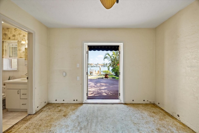 interior space with a water view and sink