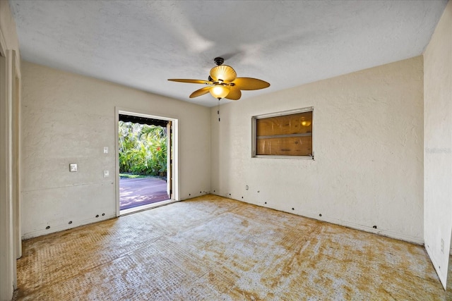 spare room featuring ceiling fan and light carpet