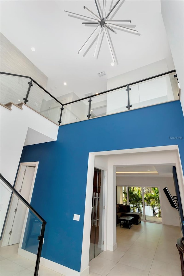 empty room featuring a towering ceiling