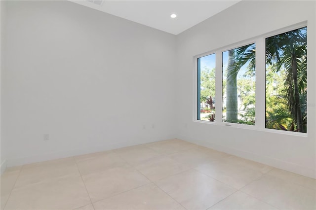 spare room with light tile patterned floors