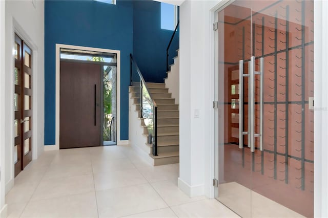 foyer entrance featuring light tile patterned flooring