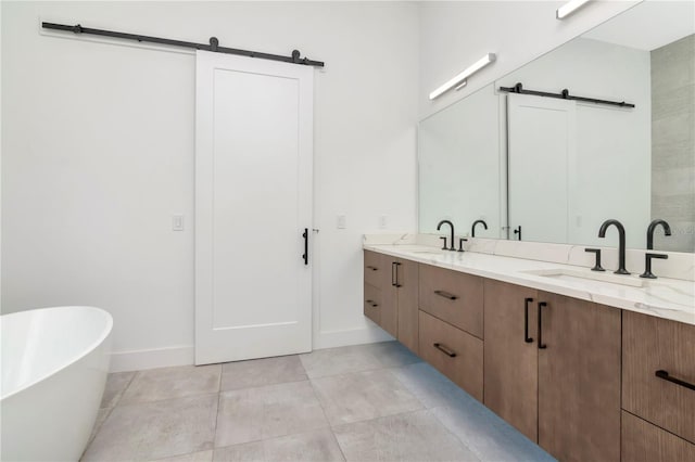 bathroom with vanity, a bathtub, and tile patterned floors