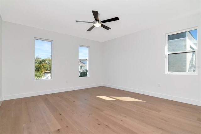 spare room featuring light wood-type flooring and ceiling fan