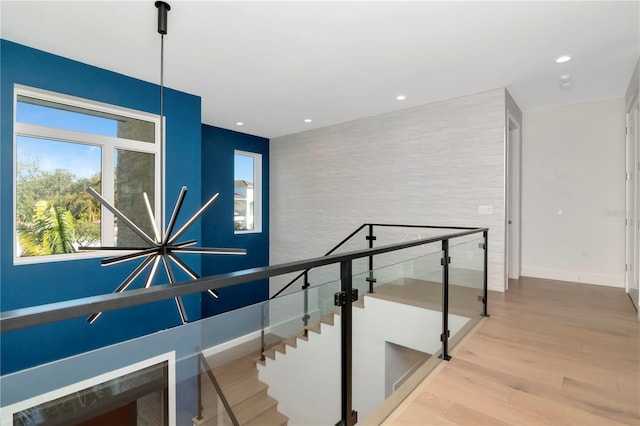 stairs featuring hardwood / wood-style floors