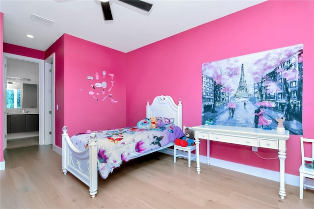 bedroom with hardwood / wood-style floors and ceiling fan